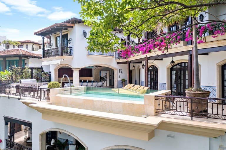 Sunny Mediterranean-inspired architecture in Las Catalinas, Costa Rica with terraces, tropical greenery, and coastal luxury design